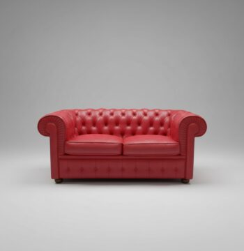 Divano rosso stile "Chesterfield"