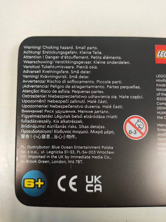Scatola di Latta LEGO Ninjago Legacy un Duello tra Zane e un Draconiano 2025